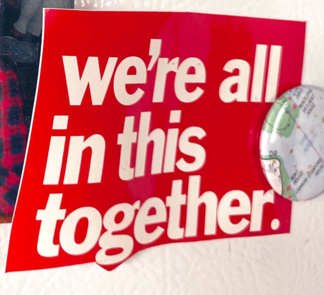 We’re all in this together white letters on red background headline Oakland magnet