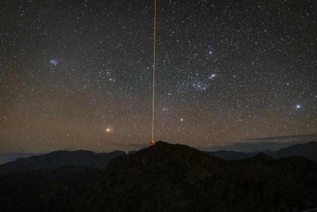 "The Gemini South telescope, one half of the International Gemini Observatory, operated by NSF's NOIRLab, with its laser guide star (LSG) beaming out into the star-speckled sky."

International Gemini Observatory/NOIRLab/NSF/AURA/A. Shugart, CC BY 4.0, via Wikimedia Commons.