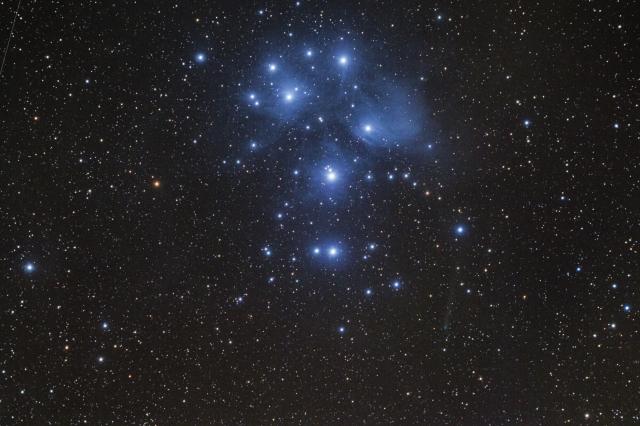 "The M45 Pleiades Cluster and the PanSTARRS c/2015ER61 Comet, that is moving away from us, is around the tenth magnitude."

gianni, CC BY-SA 2.0, via Wikimedia Commons or Flickr: https://flic.kr/p/WGLwrq