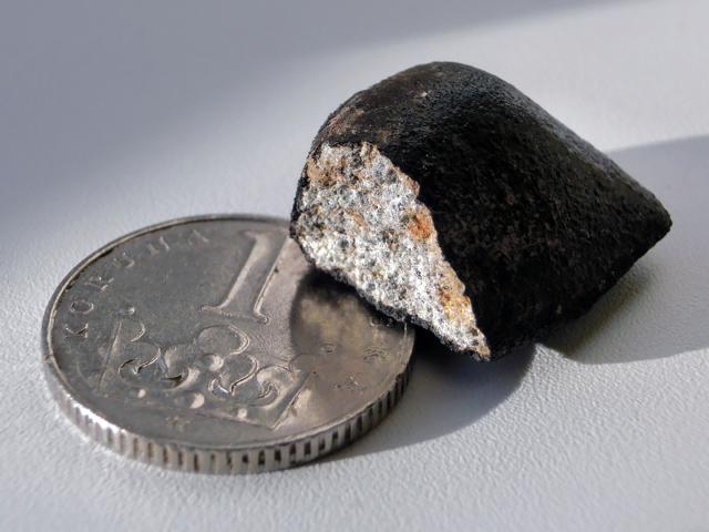 "The meteorite Zdar nad Sazavou seen as a fireball mass of 6 grams. It fell in the Czech Republic on December 9, 2014 and was found after the fall location was predicted from fireball images."

IAUPavel Spurny, Astronomical Institute of the Czech Academy of Sciences., CC BY 4.0, via Wikimedia Commons.