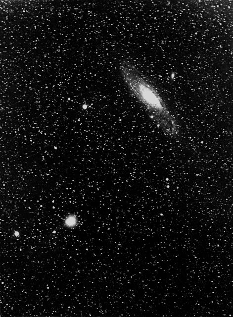 Holmes' Comet and the Andromeda Nebula on November 10, 1892.

Edward Emerson Barnard, Public domain, via Wikimedia Commons. Color edits.