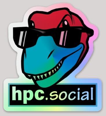 Photo of the hpc.social dino head and website address logo sticker. The dino head is a friendly grinning tyrannosaur wearing sunglasses and the sticker has a holographic irridescent metallic background and the hpc.social address in a box at the bottom.