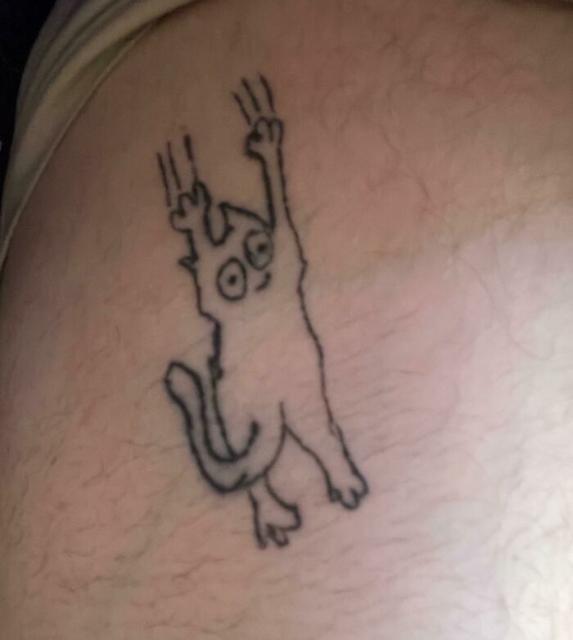 cartoon cat tattoo