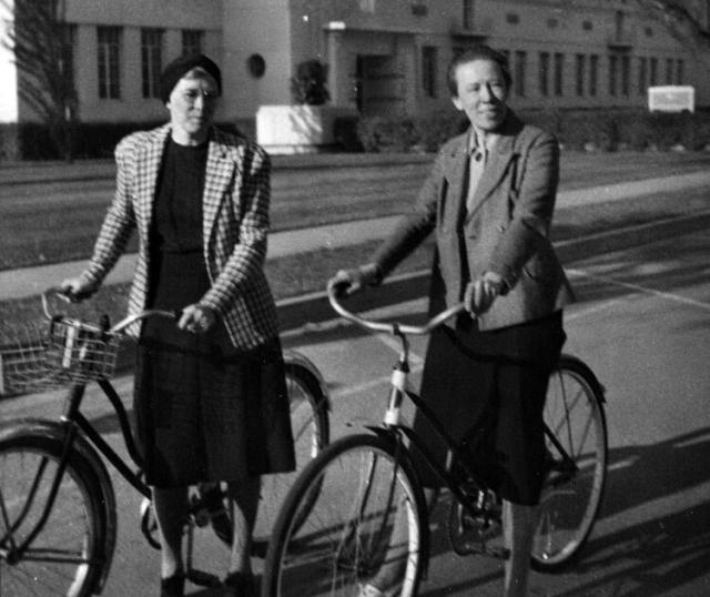 Katherine Esau Esau & a friend with bicycles on the UC Davis campus.
