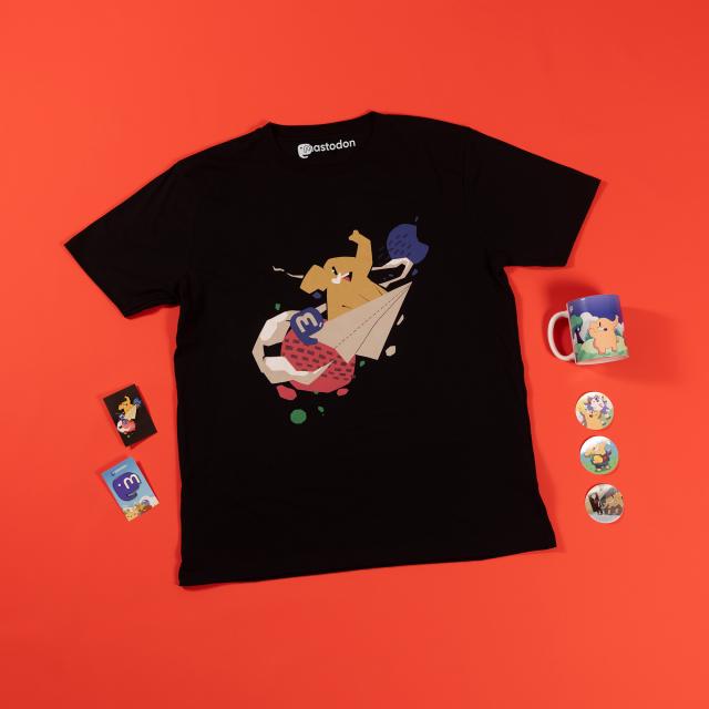 Mastodon t-shirt, enamel pins, mug, and stickers laid out on an orange backdrop. The designs are very cute.