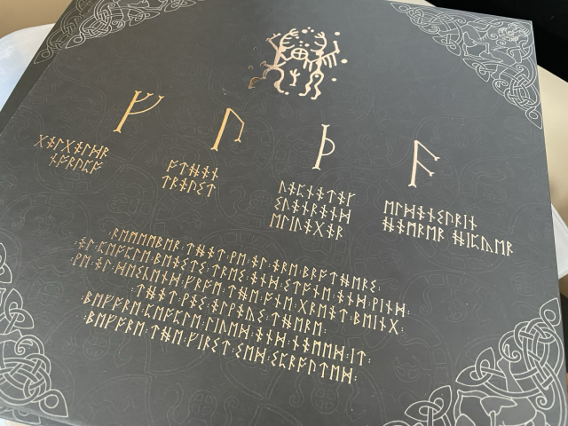 The back of a vinyl record. Everything is spelled using runes.