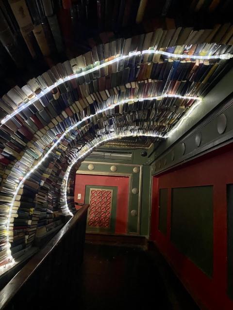 Books forming a tunnel in The Last Bookstore
