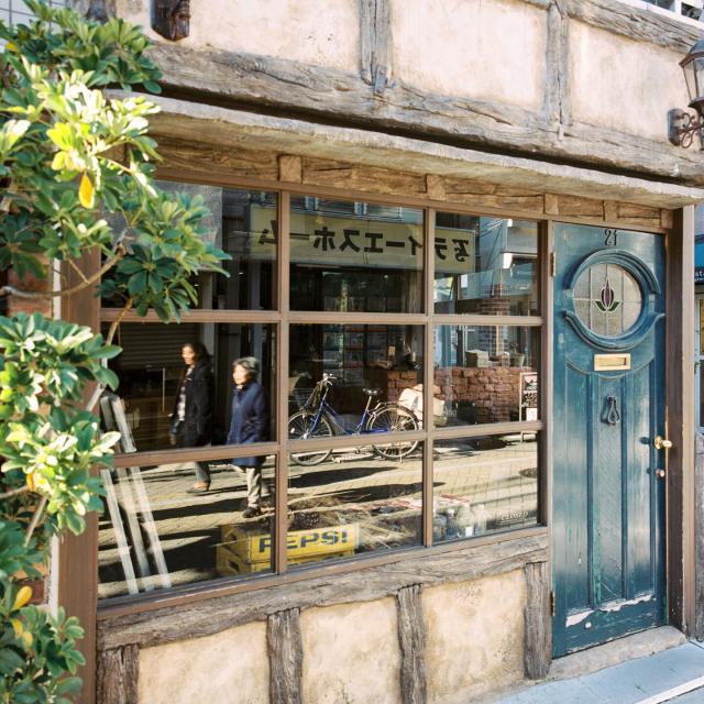 Street life reflected in a shop window, Kōenji, Tokyo, Japan.