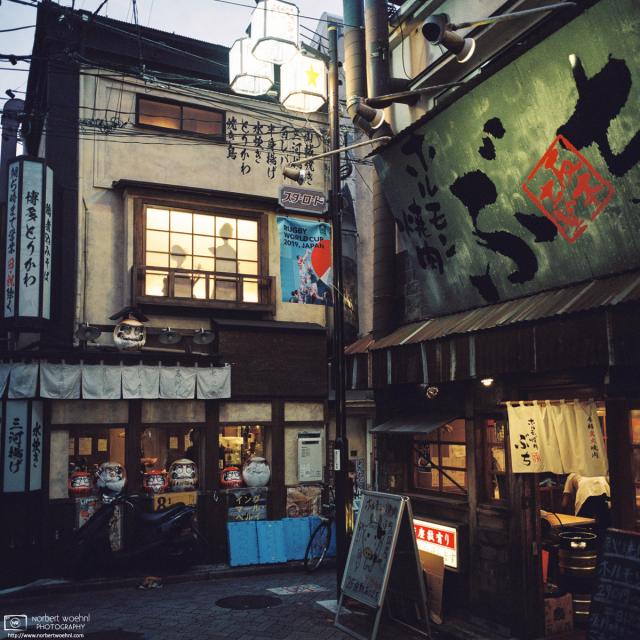 Restaurants preparing to open for the evening along Star Road in Asagaya, Tokyo, Japan.
