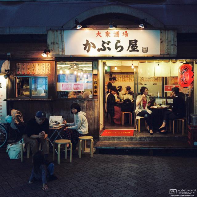 Patrons enjoying a nice autumn evening at an Izakaya (Japanese-style pub) in Asagaya, Tokyo, Japan.