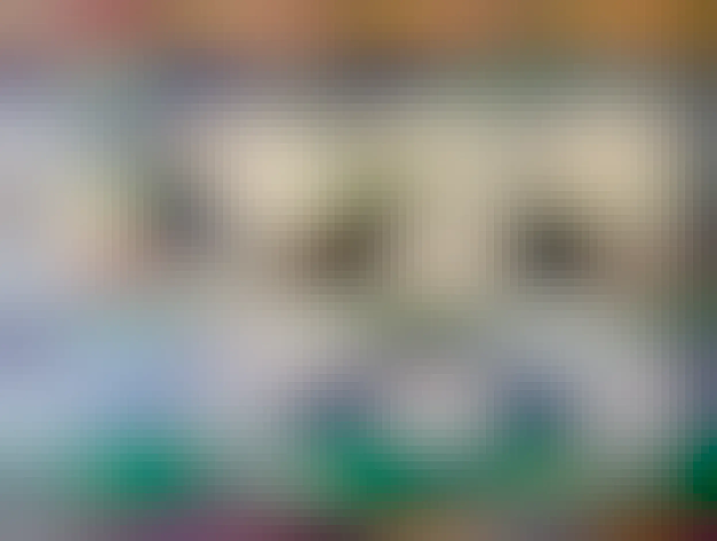 A photograph of a wall mounted, plastic cow, that dispenses condiments from its udders. Really