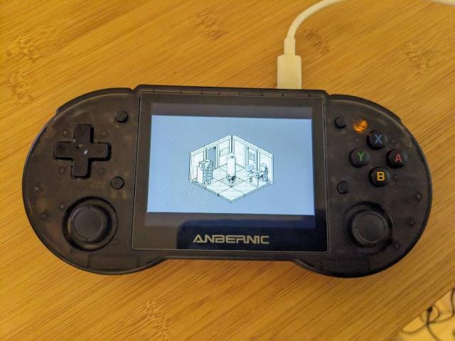 A Linux based handheld gaming device showing the first screen of the game Oquonie