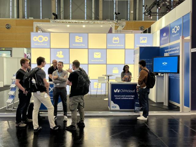 People gathered around the Nextcloud booth, partnered with OVHcloud, at the it-sa trade show