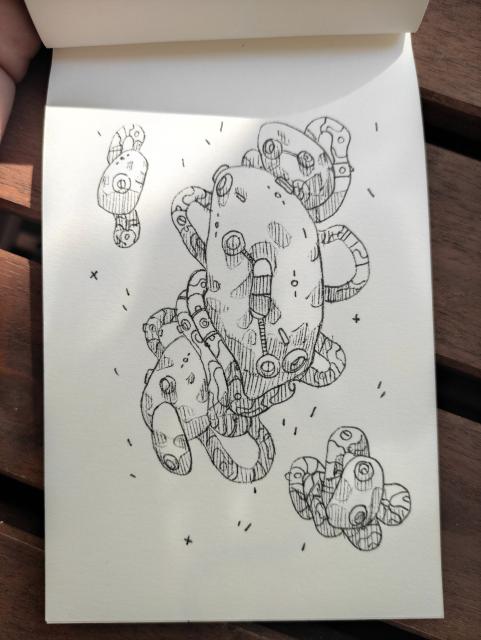 A black & white sketchbook illustration of irregular & organic looking technological shapes, floating freely. Tubes slung loosely around them as without gravity.