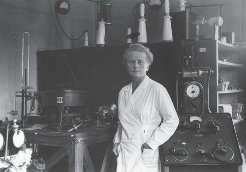 Ida Noddack in her laboratory at the University of Freiburg, where she and Walter Noddack worked from 1935 to 1941. She is standing in front of her X-ray spectrograph. (Date and photographer unknown; courtesy of University Archives, KU Leuven, Archive Walter and Ida Noddack-Tacke, nr. 51.)