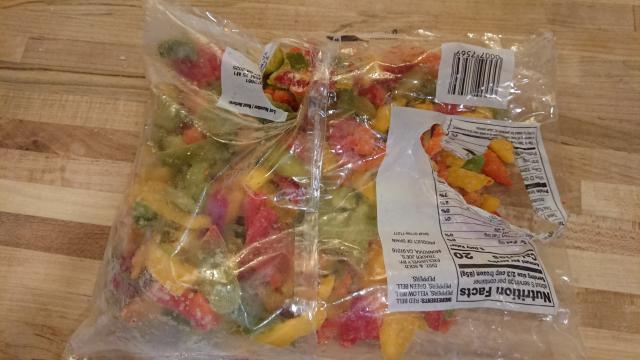 The same bag of peppers as before, but with a new, separate hole in an entirely different place that makes it impossible to pour peppers out of the bag without them also spilling out the other hole.