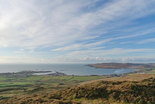 village around a bay seen from a small hill on a sunny day