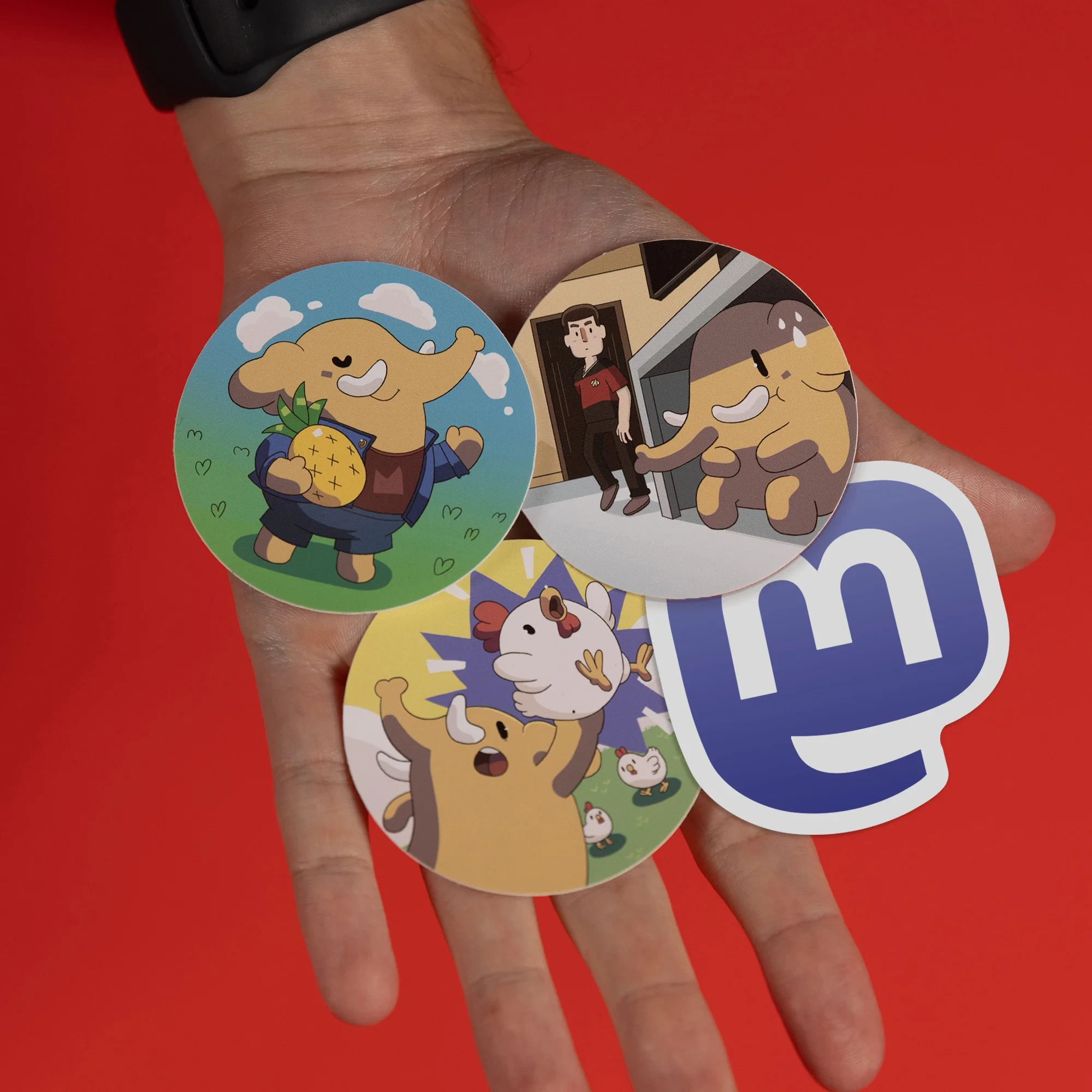 A Mastodon sticker pack, featuring 3 round stickers with elephant adventures, and one Mastodon logo sticker.