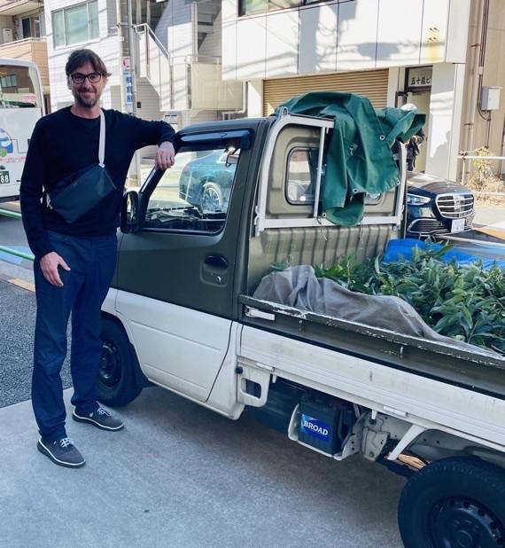 Me standing next to a pick up truck that is shorter than me