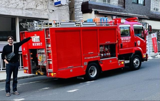 Me standing next to a fire engine