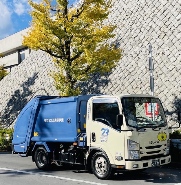 A small garbage truck