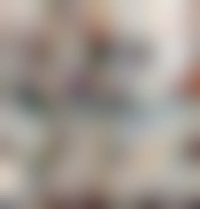 A chess board with several white pieces (king, queen, bishop, pawns) but only one black piece. The black piece is made up of several black pieces glued together using two rooks as a base, two bishops on top of the rooks to form legs, the king and pawns as torso, and knights, queen, and pawns as outstretched arms. The concoction is three times as tall as any regular piece, and looks like a menacing creature resembling a transformer from the movie looming over the board. 