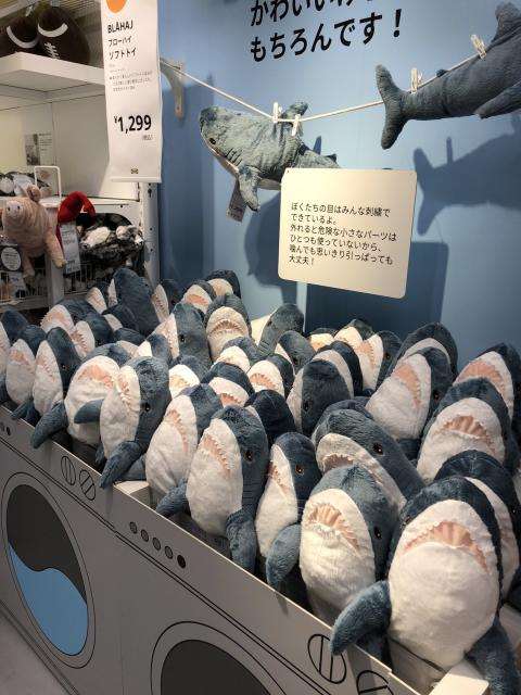 Another IKEA displaying Shark Plushies (blåhaj) with all of them “standing up” in the container, all of them having the teeth side facing the viewer