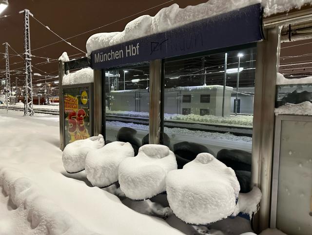 Munich central station, 40cm snow on a seat bench 