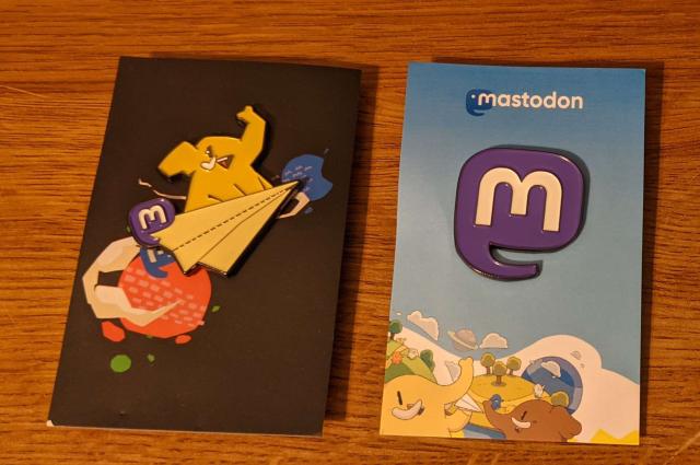 A photo of the Mastodon Elephant and Mastodon Logo V2 Pins from the Mastodon Fresh store.