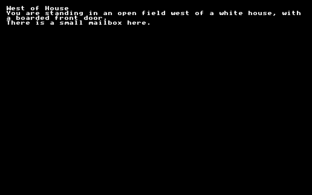 A screen with text that reads: West of House / You are standing in an open field west of a white house, with a boarded front door. / There is a small mailbox here.