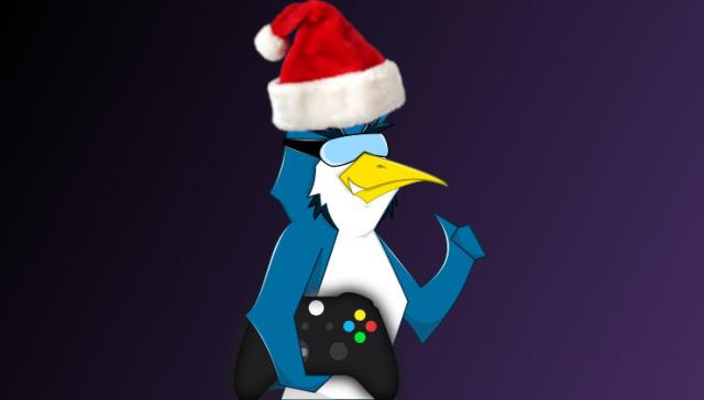 GamingOnLinux tux with holding a gamepad with a santa hat