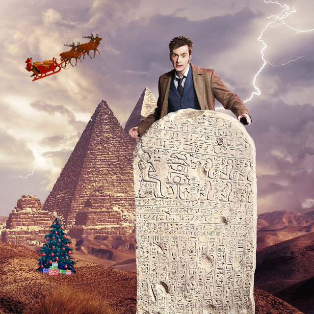 Dr Who top of an Egyptian tablet, with a Christmas tree and Father Christmas flying over the pyramids with lightning bolts. If you came here for answers, I’m not telling you what it is hehe.