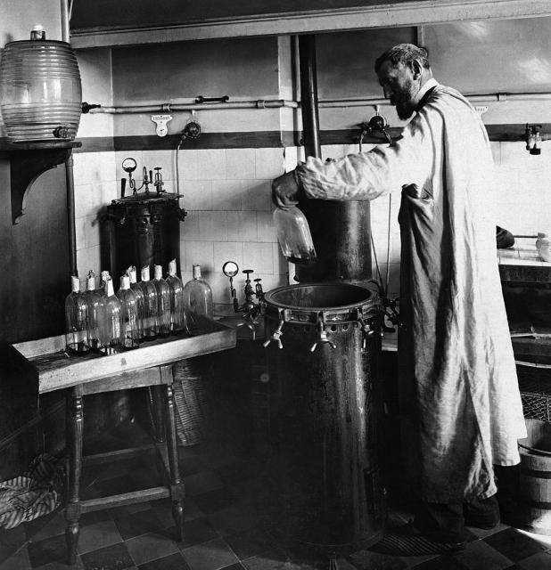 Louis Pasteur performing an experiment in his laboratory.