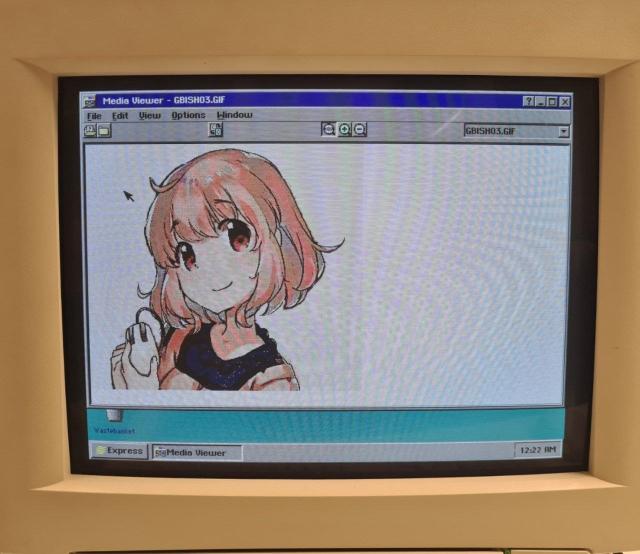 Media viewer showing a GIF image of a girl named Maiko from "16-bit sensation" manga