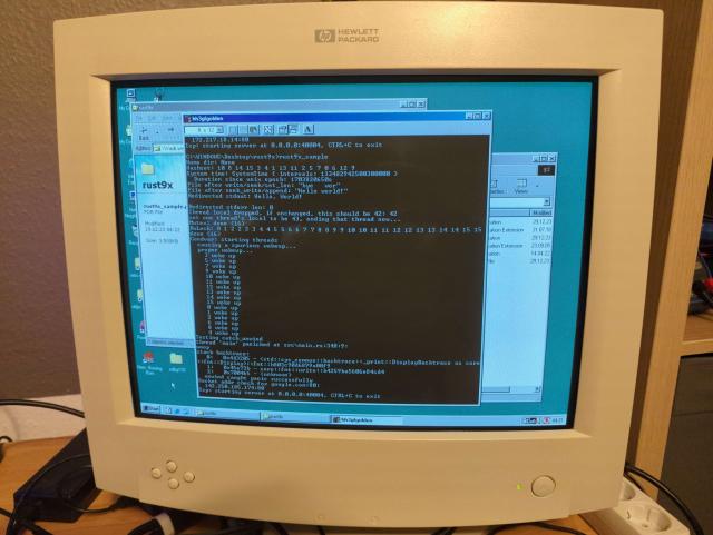 Picture of a CRT monitor, displaying a sample test program writting in Rust, running on Windows 98SE