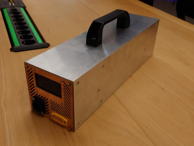 Back view. The back consists of another milled PCB that holds the Powercon True1 power input socket, the XT60 24V power output plug and a large OLED screen.