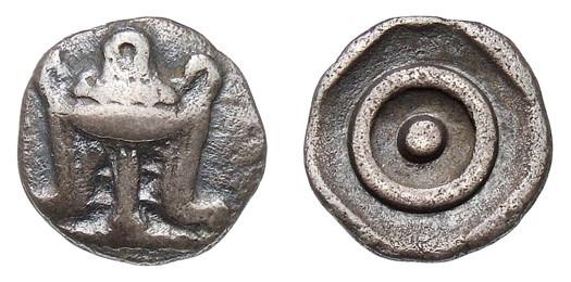 Coin of Delphi with the Omphalos ⊙ and Tripod.

Münzkabinett Berlin, Public domain, via Wikimedia Commons.