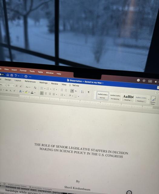 Open laptop against a snowy window. Screen reads:

“THE ROLE OF SENIOR LEGISLATIVE STAFFERS IN DECISION. MAKING ON SCIENCE POLICY IN THE U.S. CONGRESS

By Sheril Kirshenbaum”