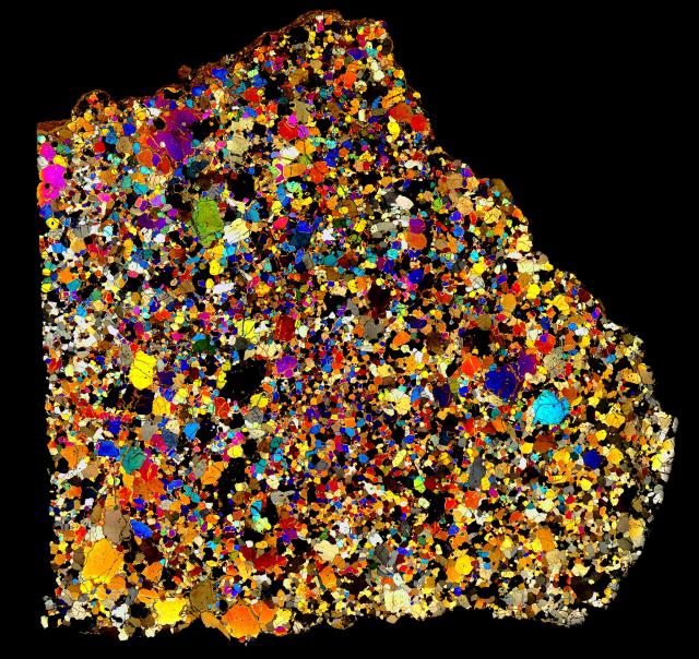 Another of the more colorful examples in XPL, Northwest Africa (NWA) 4801 Meteorite Thin Section - Angrite.

Solar Anamnesis, CC BY-NC-ND 2.0 via Flickr: https://flic.kr/p/QjPojz