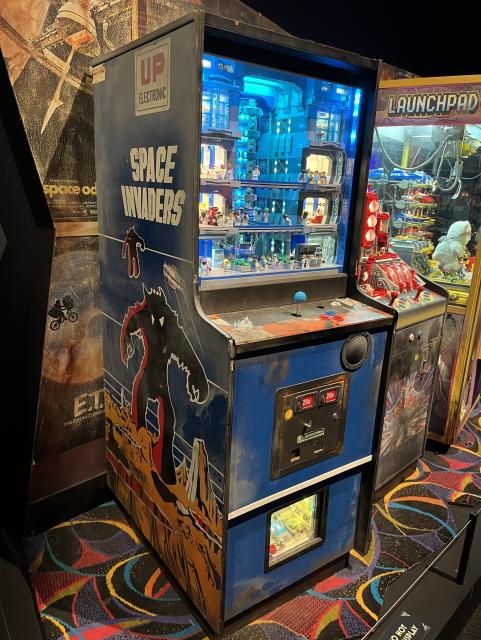 Vintage Space Invaders cabinet, with screen replaced by a futuristic Lego environment.
