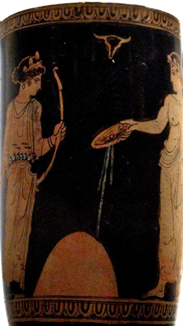 "Libation of Artemis and Apollo at omphalos."

Shakko, CC BY-SA 3.0, via Wikimedia Commons. Color edits.