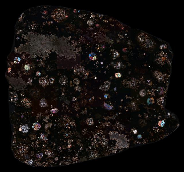 Thin Section of the Northwest Africa (NWA) 2086 Meteorite in Cross Polarized Light.

Solar Anamnesis, CC BY-NC-ND 2.0 via Flickr: https://flic.kr/p/2kQANYC