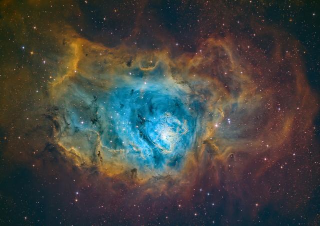 "The Lagoon Nebula in SHO."

Darko7411, CC BY-SA 4.0, via Wikimedia Commons.