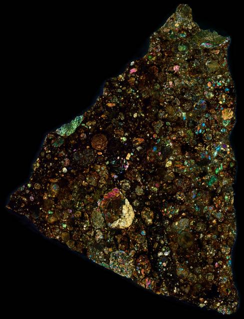 Thin Section of the Northwest Africa (NWA) 10214 Meteorite in Cross Polarized Light.

Solar Anamnesis, CC BY-NC-ND 2.0 via Flickr: https://flic.kr/p/UKWmmo