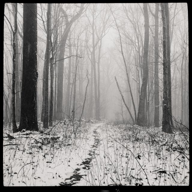 Mountain path covered with snow.