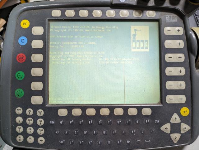 photo of the pendant screen showing bios post screen with a custom kuka boot logo. the screen looks like crap, it's a 1995 lcd.