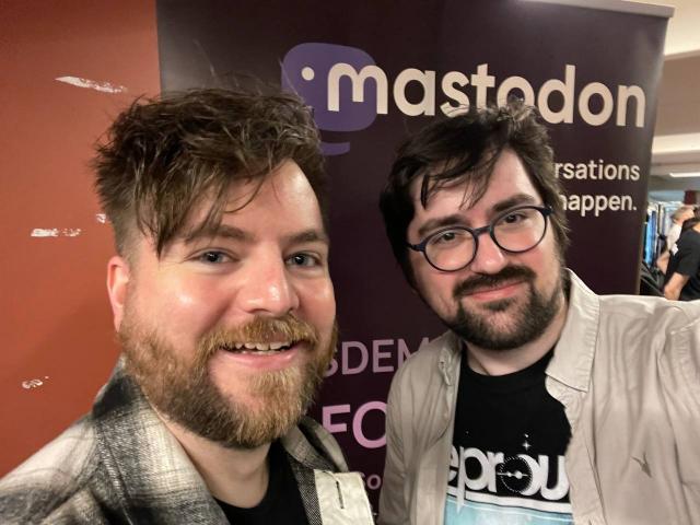 Me and Eugen in front of the Mastodon banner