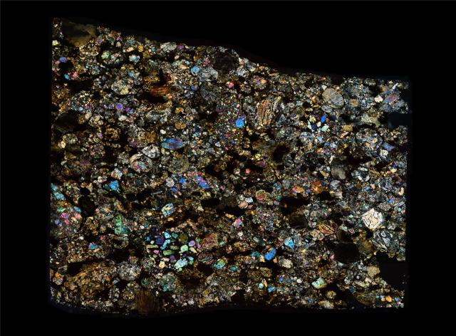 Thin Section of the Northwest Africa (NWA) 4460 Meteorite in Cross Polarized Light.

Solar Anamnesis, CC BY-NC-ND 2.0 via Flickr: https://flic.kr/p/29K44Jf
