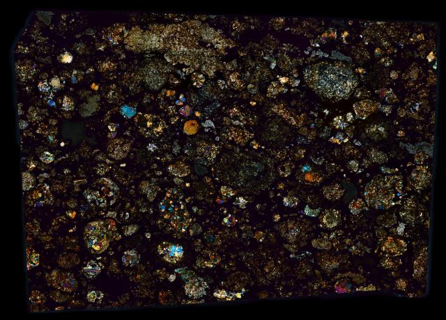 Thin Section of the Northwest Africa (NWA) 5028 Meteorite in Cross Polarized Light.

Solar Anamnesis, CC BY-NC-ND 2.0 via Flickr: https://flic.kr/p/TY98Dh