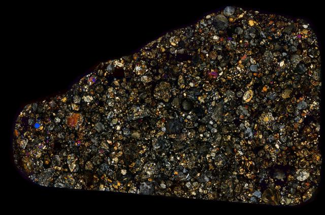 Thin Section of the Northwest Africa (NWA) 4910 Meteorite in Cross Polarized Light.

Solar Anamnesis, CC BY-NC-ND 2.0 via Flickr: https://flic.kr/p/Ue5etG
